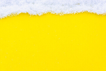Snow white and yellow background with place for text.
