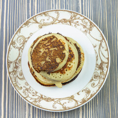 Fried cheesecakes or pancakes on a plate.