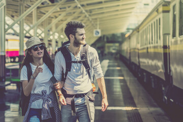 Multiethnic Travellers are walking and finding the train at the train station, Travel and transportation concept