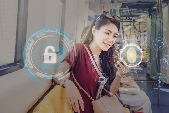 Asian woman passenger using the smart mobile phone by Fingerprint scan for support security access with biometrics identification in the Skytrain rails or subway, Business Technology sceurity Concept. - Powered by Adobe