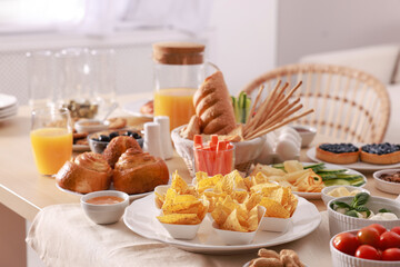 Dishes with different food on table in room. Luxury brunch