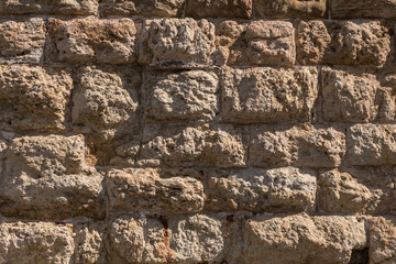 Fragment of ancient wall of rough stone bricks, Crete, Greece