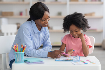Child development specialist working with little girl