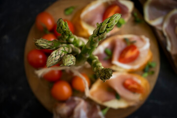 jamon sandwich, asparagus on old background