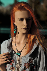 female portrait in nature with hard sunlight