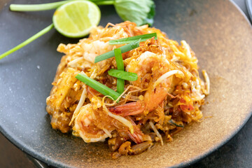 Pad Thai (Stir-fried rice noodles with shrimp) flavor with sugar, lime, ground dried chilies and peanuts; Thailand's popular dishes.