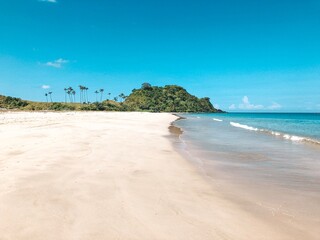 beach with sand and blue sky