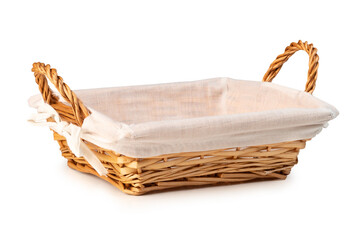 Empty wicker bread basket with white napkin isolated on a white background