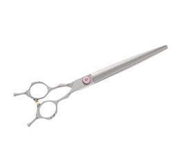Scissors for cutting people and pets. Grooming scissors. Closed scissors on a white isolated background. Side view.