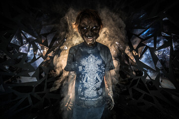 scary sorcerer in smoke. voodoo rite