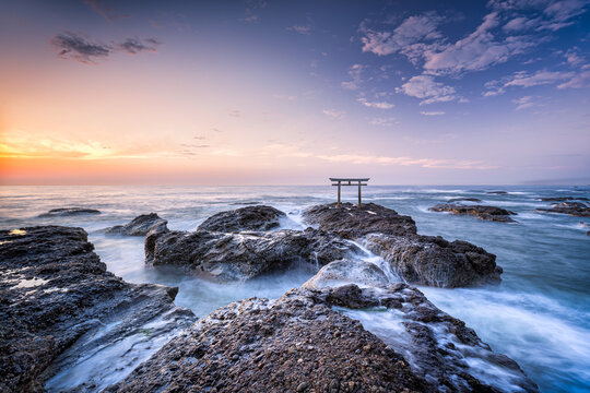 Traditional Japanese torii gate at sunrise, Oarai Isosaki Shrine, Ibaraki Prefecture, Japan
