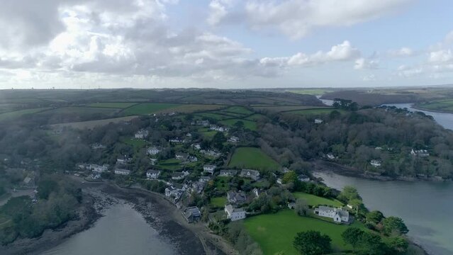 Aerial overlooking a Cornish fishing village on an overcast day