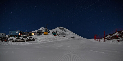 Mountain shelter near the peak of Elbrus late at night. Terskol. Russia, november 2019.