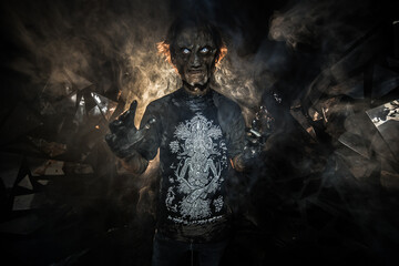 scary sorcerer in smoke. voodoo rite