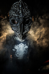 scary sorcerer in smoke. voodoo rite