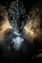scary sorcerer in smoke. voodoo rite