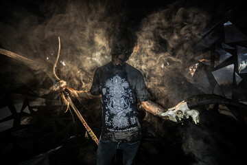 scary sorcerer in smoke. voodoo rite