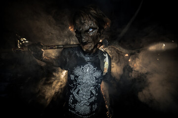 scary sorcerer in smoke. voodoo rite