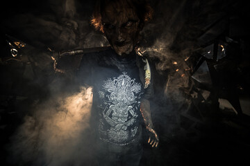 scary sorcerer in smoke. voodoo rite