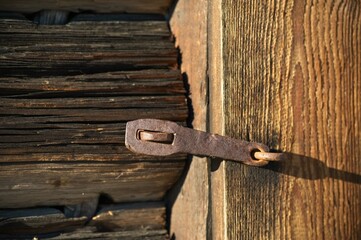 Old doorlock on a log cabin