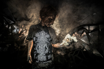scary sorcerer in smoke. voodoo rite