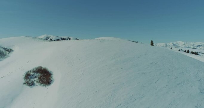 Snowy Idaho mountains aerial 4k footage on a sunny winter day