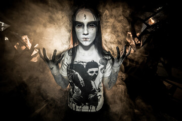 the sorceress stands in the smoke. voodoo rite