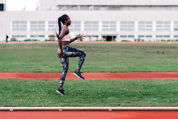 African-American young athlete warming up