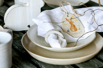 Easter table setting with empty craft ceramic tableware
