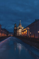 Church of the Savior on Spilled Blood (also known as Tserkovʹ Spasa na Krovi) at night in Saint Petersburg city, Russia. Griboedov Canal covered with ice. Travel in winter Russia theme.
