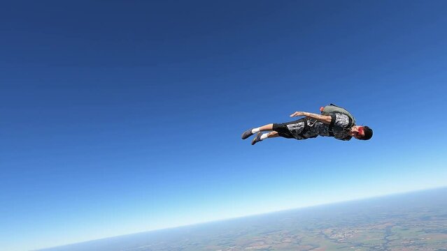 Relaxed and happy skydiver man on a summer day.