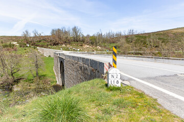 N2 Km118 paved road at Ponte de Reconcos bridge over Balsemão river - Bigorne, Magueija e Pretarouca, Lamego, district of Viseu, Portugal - obrazy, fototapety, plakaty