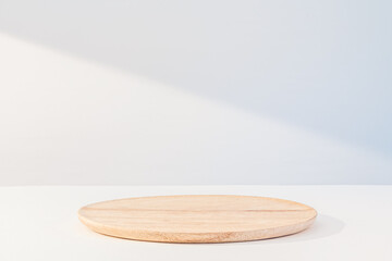 Wooden dish on white. Food or product podium
