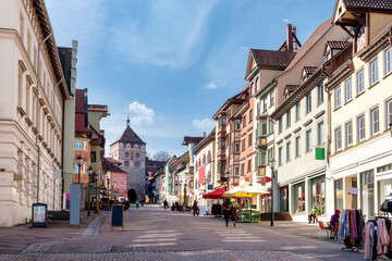 Fototapeta na wymiar View to the Black Gate (Schwarzem Tor) in the down town of Rottweil on a sunny day in spring, Black forest, Germany