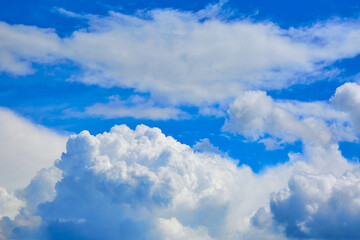 Blue sky with white cumulus clouds. Banner. Background. Nature wallpaper. Sunny weather forecast. Religion concept. Heaven landscape. Outdoor scenic. Bright pattern design. Copy space. Fresh air