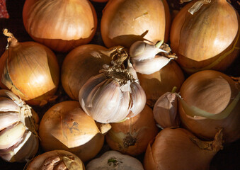 a lot of onions and garlic top view. High quality photo