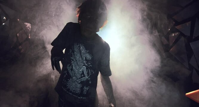 scary sorcerer in smoke. voodoo rite