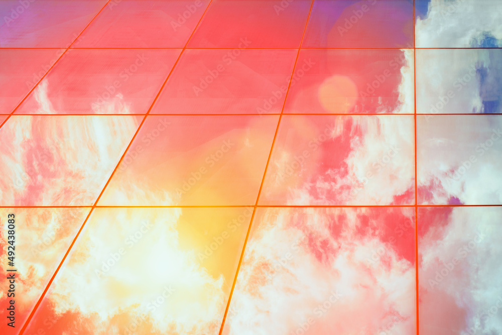 Poster web banner modern glass architecture with reflection of red and blue sunset sky. dramatic bright col