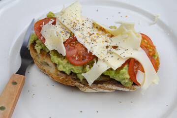 delicious sandwich with cheese, tomato and avocado