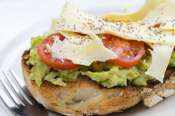 delicious sandwich with cheese, tomato and avocado
