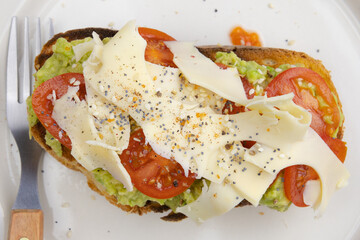 delicious sandwich with cheese, tomato and avocado