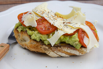 delicious sandwich with cheese, tomato and avocado