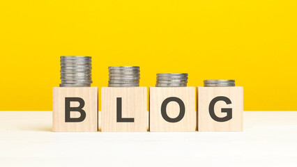 text blog on wooden cubes on yellow background
