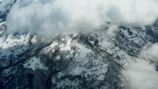 Drone shooting of Rocche del Crasto in winter, a mountainous and rocky complex where the golden eagle nests, Nebrodi, Sicily, Italy. Typical villages set between the fortresses. Longi and Alcara.
