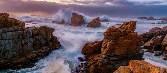 Waves crashing on rocky coastline