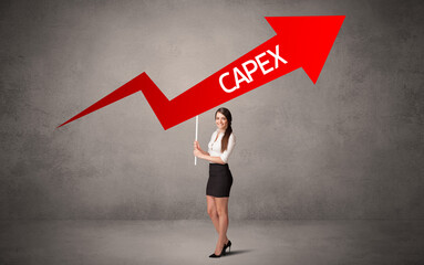 Fototapeta premium Young business person in casual holding road sign