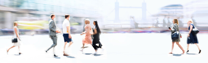 People walking in the City, blurred wide background representing modern fast moving life in the...