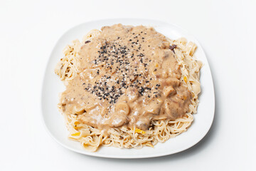 Vegan food. Close-up of homemade fettuccine pasta with Alfredo sauce.
