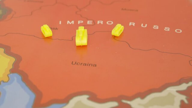 Geographic map illustrating the Russian and Ukrainian borders, Russian tanks attack Ukrainian territory, but hand sweeps them away, putting a peace flag in its place.