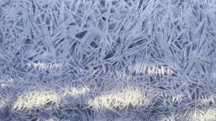 Winter Texture Icy Background background for banner closeup. Ice crystals over frozen river. Ice crystal texture. Background transparent cracked ice crystals. Frozen water surface.